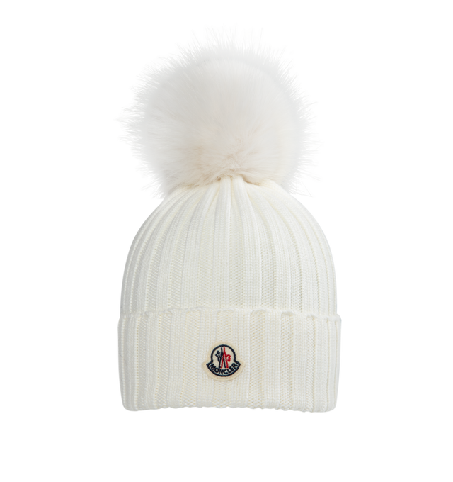Image 1 of 2 - WHITE - MONCLER Wool Beanie featuring ultra-fine Merino wool, faux fur pom pom, rib knit and Gauge 5. 100% virgin wool. Made in Bulgaria. 