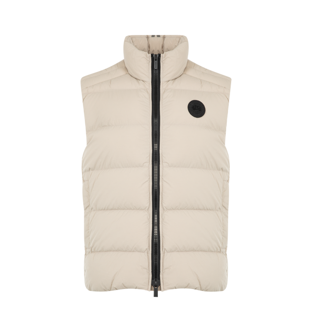 Image 1 of 2 - WHITE - CANADA GOOSE Crofton Vest EnduraLuxe featuring water-repellent protection, packable into interior left pocket, converts into a cinchable bag with a carrying strap, two-way zipper and two exterior tricot-lined zippered hand pockets. 100% recycled polyamide. Made in Canada.