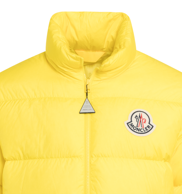Image 3 of 3 - YELLOW - MONCLER CITALA SHORT DOWN JACKET featuring recycled longue saison lining, down-filled, stand collar, zipper closure, zipped pockets, elastic cuffs and hem and felt logo patch. 100% polyamide/nylon. Padding: 90% down, 10% feather. 