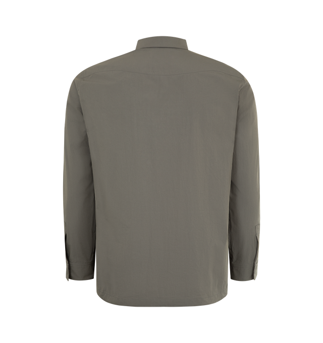 Image 2 of 3 - BROWN - THE ROW Thom Pantsenan Shirt featuring concealed button closure, button cuffs, classic collar, side slit pockets and straight hem. Made in Italy.