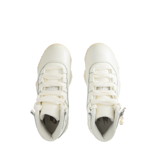 Image 5 of 5 - WHITE - JORDAN Air Jordan 11 Retro Sneaker featuring patent leather upper, lace-up front, foam midsole, Air cushioning, rounded toe, pearl charm and rubber outsole.