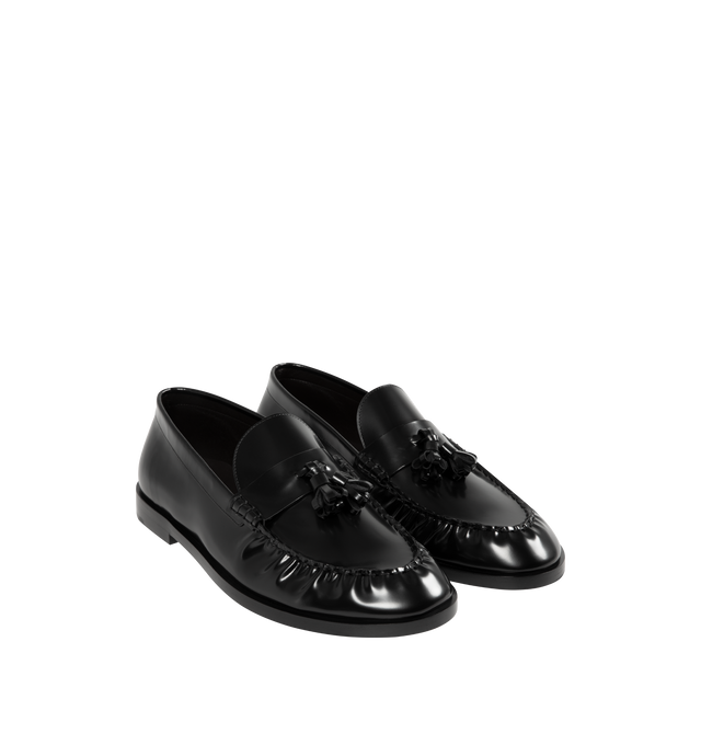 Image 2 of 4 - BLACK - THE ROW Loafers featuring tassel detail at strap, ruched welt stitching and box calf leather upper and sole. Made in Italy.