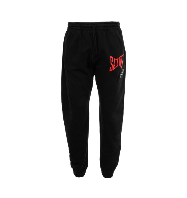 Image 1 of 4 - BLACK - SAINT MICHAEL Logo Sweatpants featuring jersey texture, elasticated waistband, two side welt pockets, logo print to the front, elasticated ankles, rear patch pocket and drawstring waist. 89% cotton, 8% polyester, 3% rayon. 