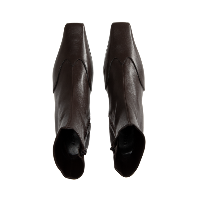 Image 4 of 4 - BROWN - KHAITE Nevada Stretch Low Boot featuring mid-calf urban cowboy boot, calfskin wingtip traced by tonal topstitching, pointed toe and side zipper closure. Heel Height: 1.8 in. 100% lambskin. Made in Italy.