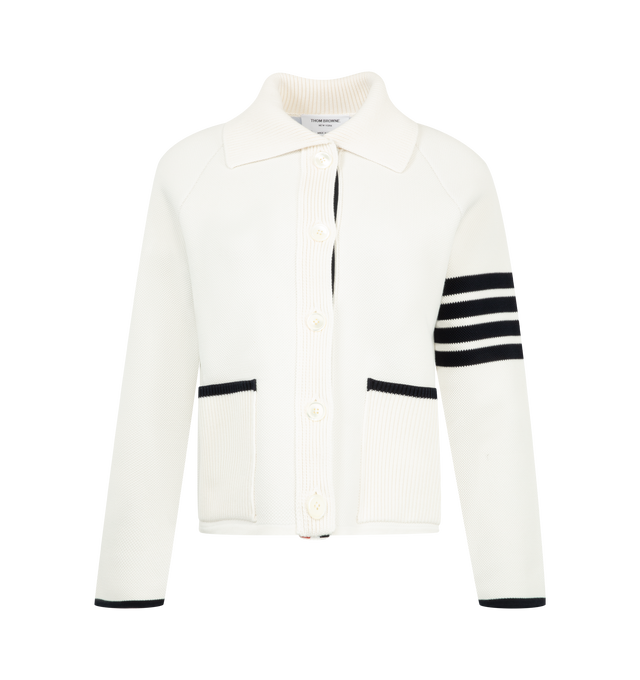 Image 1 of 3 - WHITE - Thom Browne Womens Double-Face Piqu Stitch Polo Collar Jacket is crafted from a virgin wool and cotton blend double-face piqu knit and features a rib-knit polo collar, front button closure, raglan sleeves, rib-knit patch pockets with contrast tipping, rib-knit cuffs and hem, signature 4-bar detailing, internal RWB grosgrain trim, and the signature striped grosgrain loop tab. Main Material: 50% Virgin Wool, 47% Cotton, 3% Polyamide. Made in Italy.