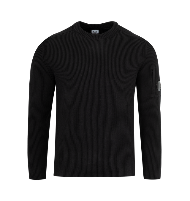 Image 1 of 3 - BLACK - C.P. COMPANY Full Rib Crewneck Lens Sweater featuring a stretch cotton/nylon blend with an English rib knit construction, iconic Lens detail, gauge 7 and regular fit. 71% cotton, 29% polyamide/nylon.