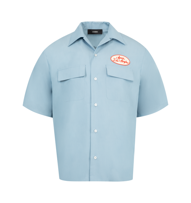 Image 1 of 2 - BLUE - AMIRI Station Patch Bowling Shirt featuring embroidered logo patches at the chest and across the back, notched collar, short sleeves, chest flap pockets and button-front closure. 60% modal, 40% polyester. Made in Italy.