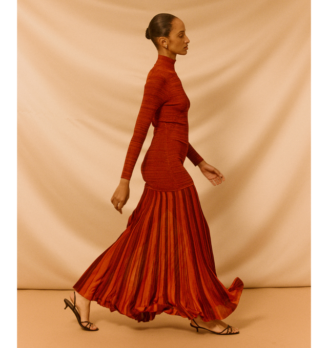 Image 3 of 5 - RED - CHRISTOPHER JOHN ROGERS Turtleneck Drop-Waist Pleated Maxi Dress featuring a drop waist with a pleated, flowy skirt, turtleneck, long raglan sleeves, body-skimming silhouette, full length and slipover style. Rayon/cellulose acetate. Made in USA.