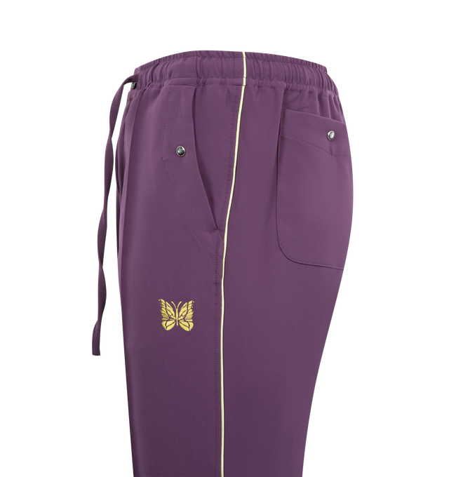 Image 3 of 3 - PURPLE - NEEDLES Piping Cowboy Pant featuring drawstring at elasticized waistband, four-pocket styling, zip fly, logo embroidered at front, pinched seam at front legs and satin piping at outseams. 89% polyester, 11% polyurethane. Made in Japan.