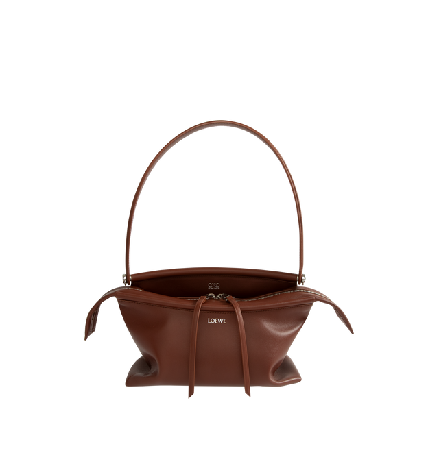 Image 1 of 3 - BROWN - Loewe Small Whisker Bag is crafted from black glazed calfskin and features a slouchy silhouette with a structured handle and oversized zip opening. Designed for shoulder, crossbody, or hand carry, it includes a detachable strap with rotating dog clips, articulated zipper pulls, foldable D-rings, an exterior flat pocket, and an interior flat pocket. Gold-tone hardware and embossed Loewe and Double L branding complete the design. Fits a large phone, small wallet, sunglasses, and keys. M