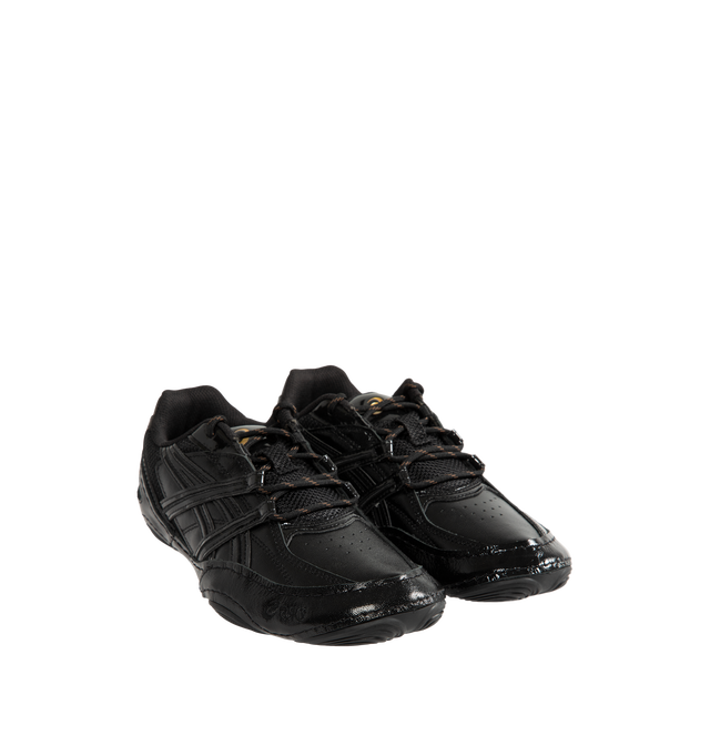 Image 2 of 5 - BLACK - Asics Hypersync Sneakers are inspired by the brand's archived wrestling and track & field footwear, combining heritage design with modern comfort. Featuring a breathable air mesh upper with textured patent leather overlays, decorative stitching, and premium gold logo detailing, these designer sneakers deliver a sleek, low-profile silhouette. Finished with an OrthoLite sockliner for enhanced cushioning, a durable AHARPLUS rubber outsole inspired by the SNAPDOWN wrestling shoe, and a no