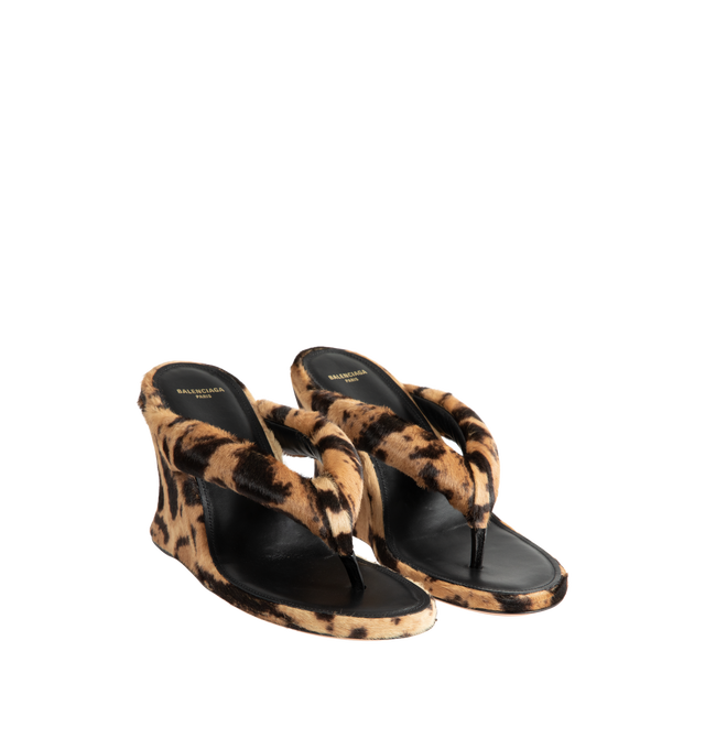 Image 2 of 4 - MULTI - Balenciaga Womens Gaeta Wedge Thong Sandals are crafted from ocelot-print calf hair. Feature a round toe, padded thong strap, slip-on design, wedge heel, and leather sole. Main Material: 100% Calf Hair Leather; Sole: Leather. Made in Italy.