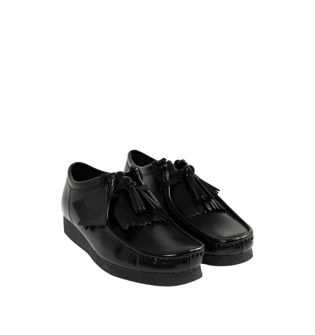 Image 2 of 4 - BLACK - CLARKS Wallabee Hi Shine Leather Shoe featuring dress leather uppers, lace tassels, three FOBS Clarks Originals, kiltie FOB and 200 years FOB, removable tonal kiltie, natural pebble crepe with a black sole spray, Clarks Originals heat embossed logo on sock, moccasin construction and hand stitched apron seam.