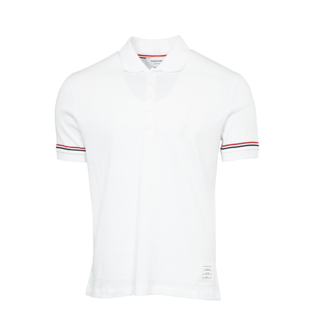 Image 1 of 2 - WHITE - THOM BROWNE RWB Stripe Polo Shirt featuring partially buttoned front, straight fit, slightly stretchy fabric, falls to the hip and stripes on sleeves. 100% cotton. 