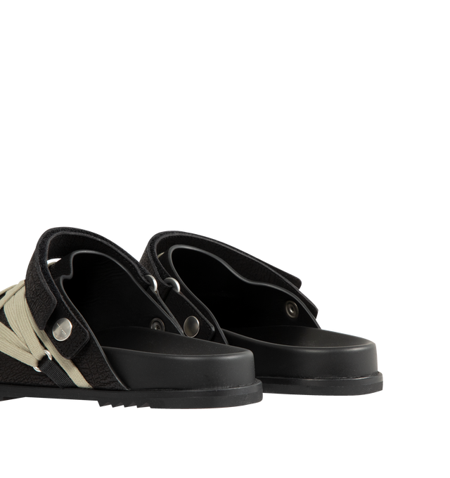 Image 3 of 4 - BLACK - Rick Owens Men's Megalace Granola Mules crafted from medium weight cracked calf leather. Slip-on covered style featuring an open back with adjustable strap, sculpted footbed, sharktooth sole and signature mega-lacing detail in a pentagram shape covering the front. 100% calf leather upper and lining, cow leather sole with rubber detail. Made in Italy.