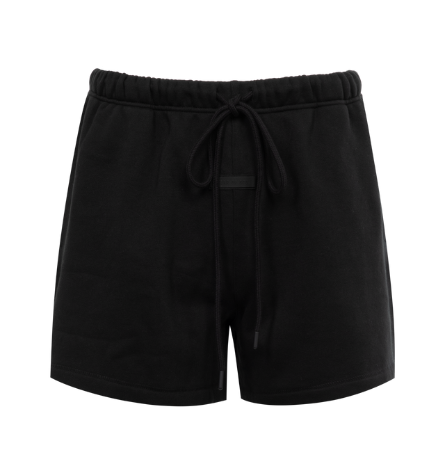 Image 1 of 3 - BLACK - FEAR OF GOD ESSENTIALS Running Short featuring cropped length, an encased elastic waistband with elongated drawstrings, side seam pockets and a rubberized label at the center front. 80% cotton, 20% polyester.  