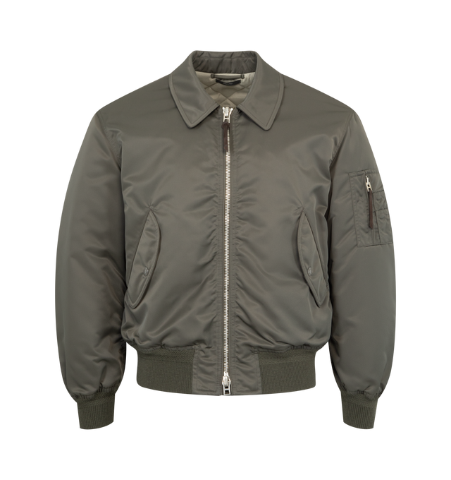 Image 1 of 3 - GREEN - TOM FORD Satin Flight Bomber featuring nylon satin, pocket on the sleeve, two-way zipped front, two front flap pockets, ribbed cuffs and hem and collar. 100% polyamide. Lining: 60% cupro, 40% cotton. Made in Italy.