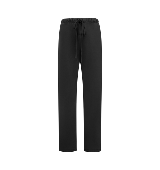 Image 1 of 3 - BLACK - FEAR OF GOD ESSENTIALS Heavy Fleece Flare Sweatpant featuring 520gsm heavy fleece treated with a pigment dye to create rich depth of color, relaxed, flared-leg, HD-printed graphics on back of legs, encased elastic waistband with elongated drawcords, side seam pockets and a Fear of God Essentials label stitched at the center front. 100% cotton.