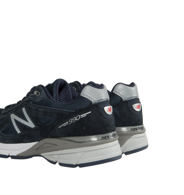Image 3 of 5 - NAVY - NEW BALANCE 990v4 Sneakers featuring low-top, paneled pigskin suede and mesh, lace-up closure, logo patch at padded tongue, padded collar, logo patch at heel counter, logo appliqu at sides, reflective text at outer side, mesh lining, textured ENCAP foam rubber midsole and treaded rubber sole. Made in United States. 
