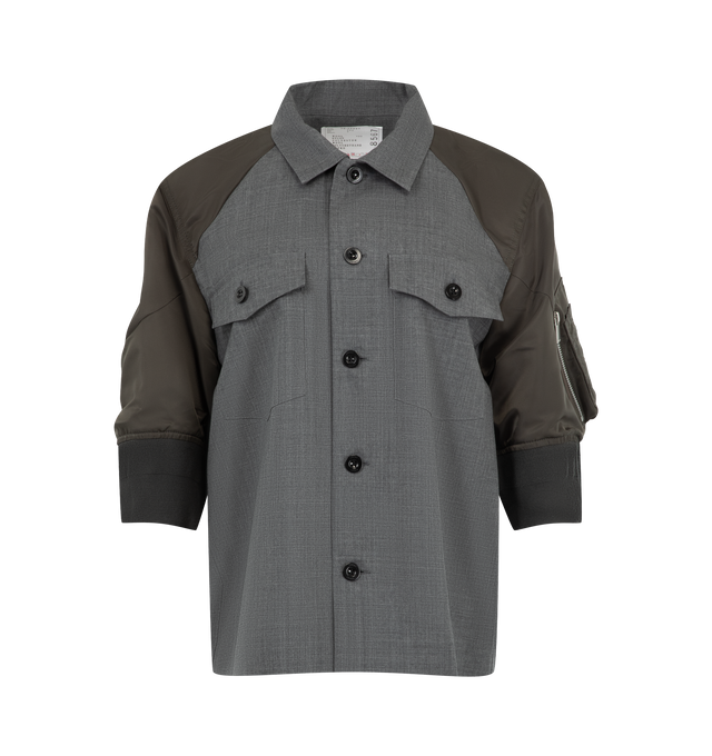 Image 1 of 3 - GREY - Sacai Womens Suiting x Nylon Twill Shirt is crafted from wool with contrasting nylon twill paneling. Features a button-front closure, point collar, long sleeves with button cuffs, and a hybrid tailored construction. Main Material: 100% Wool; Contrast 1: 100% Nylon; Contrast 2: 55% Polyester, 44% Wool, 1% Polyurethane; Lining: 100% Cupro. Made in Japan.