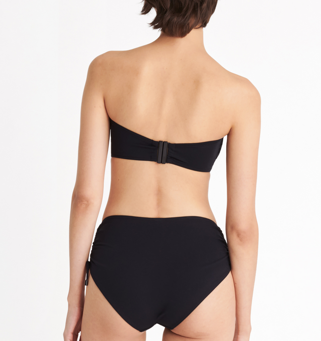 Image 5 of 6 - BLACK - ERES Show Bandeau Bikini Top featuring bust shirring at front and sides, U-shaped metal link between cups, side stays and branded large back clasp. 84% Polyamid, 16% Spandex. Made in Italy. 