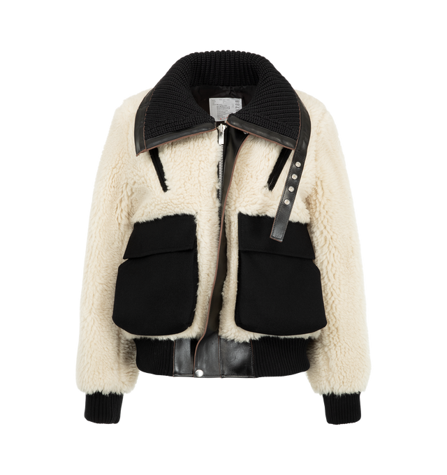 Image 2 of 4 - WHITE - Sacai Women's Wool Faux Shearling Blouson Jacket is crafted in a contrasting black and off-white mixed-fur design with plush sherpa and vegan leather trim. Materials: Wool; Polyester, Cowhide leather, Cupro.