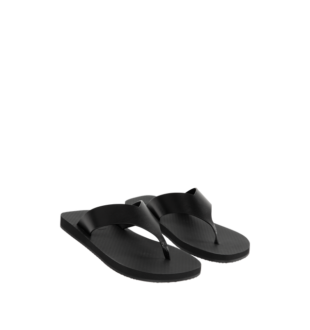 Image 2 of 4 - BLACK - THE ROW Dune Classic Ginza Sandal featuring modern flip flop sandal in sleek calfskin leather with seamless contoured strap, textured footbed, and lightly treaded rubber sole. 100% calfskin leather. Made in Italy.