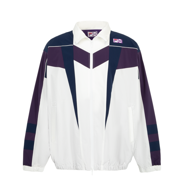 Image 1 of 3 - WHITE - Needles x Fila Men's Star Cut Oversized Windbreaker is crafted from polyester and features an oversized silhouette inspired by FILA's 1993 ski jacket, with bold color-blocked panels and sharp cut-line detailing. Created as part of the first collaboration between Needles and FILA, this lightweight outerwear style combines vintage performance influences with a contemporary streetwear aesthetic. Main Material: 100% Polyester.