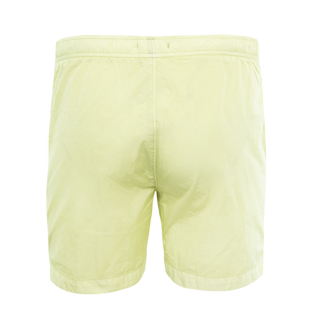 Image 2 of 3 - GREEN - C.P. COMPANY Eco-Chrome R Swim Shorts featuring tonal stitching, two side slash pockets, logo patch to the leg, short side slits, thigh-length, mesh lining and elasticated waistband with internal drawstring. 100% polyamide. 