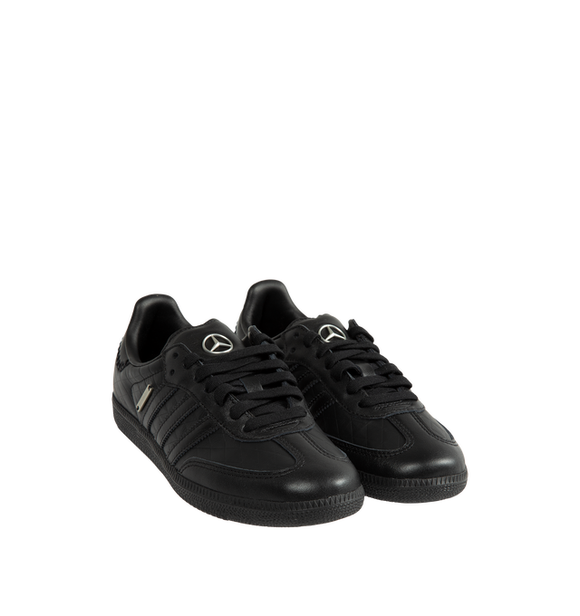 Image 2 of 5 - BLACK - Adidas Men's Samba OG Mercedes-Benz Shoes are crafted from premium leather and feature the iconic Samba silhouette with signature Mercedes-Benz branding and serrated 3-Stripes. Designed with a smooth leather lining for enhanced comfort and a durable rubber outsole for everyday traction, this collaborative style blends heritage sport design with automotive-inspired detailing. Main Material: Premium Leather. Lining: Leather. Outsole: Rubber.