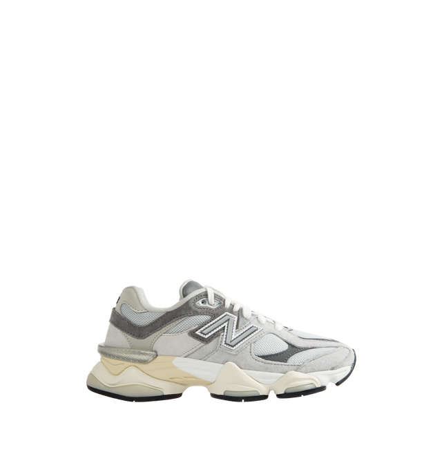 Image 1 of 5 - GREY - New Balance 9060 Unisex lifestyle sneaker with pig suede and mesh upper featuring ABZORB midsole to absorb impact, ABZORB SBS heel cushioning for additional stability and comfort, tongue logo inspired by original 991 lace jewel, translucent CR device at heel, and diamond outsole pattern inspired by classic 860 design.