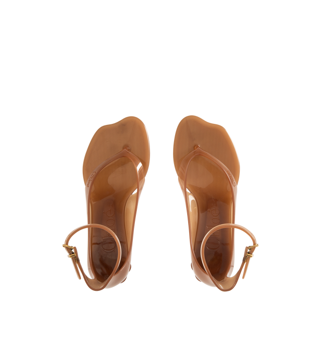 Image 4 of 4 - BROWN - CHLOE Jelly Sandal featuring transparent TPU, thong front with a distinctive wavy sole, shell-shaped heel, adjustable, buckled ankle strap and an oversized tonal Chlo logo on the sole. Sandal heel height: 1". Upper: TPU. Heel: polycarbonate.