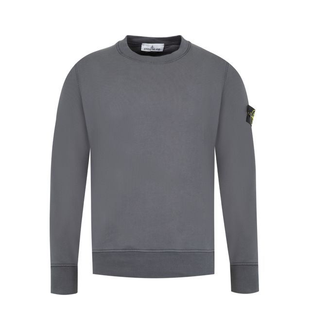 Image 1 of 3 - GREY - STONE ISLAND Crewneck Sweatshirt featuring ribbed neckline, lunette under back neckline with internal reinforcement, raglan sleeves on back, Stone Island badge on left sleeve, ribbed cuffs and bottom band, overlock stitching at seams and regular fit. 100% cotton.