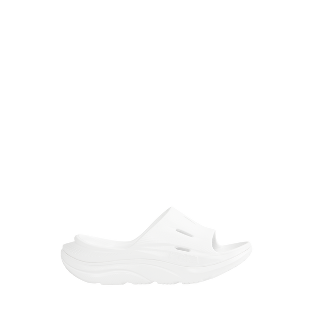 Image 1 of 4 - WHITE - HOKA Ora Recovery Slide 3 featuring perforated rubber upper with EVA sole, slip-on styling and molded footbed.