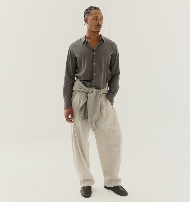 Image 2 of 4 - WHITE - THE ROW Malaya Pant featuring relaxed mid-rise pant in softly crinkled technical silk with wide straight leg, paneled sides and side seam pockets. 65% silk, 35% nylon. Made in Italy.
