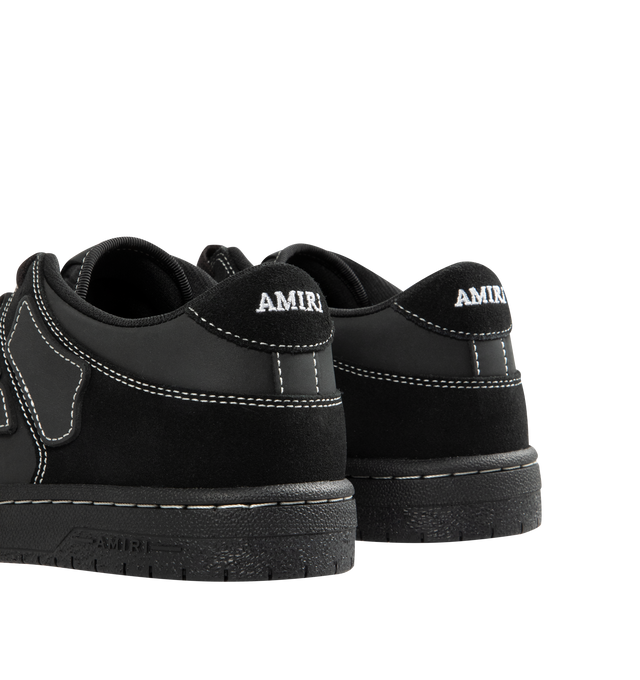 Image 3 of 5 - BLACK - AMIRI Skel Top Low Sneaker featuring low-top sneaker crafted with hand-cut skeletal appliqus along the sidewalls, perforated toe, padded collar, molded insole and lace-up style. Leather upper, textile lining, rubber sole.
