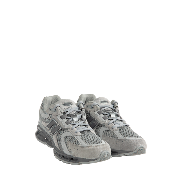 Image 2 of 5 - GREY - New Balance 1954R Unisex Sneakers feature a suede and mesh upper inspired by the 2002 and 1906 models, combining breathable mesh with synthetic and pig suede overlays. ABZORB midsole cushioning absorbs impact through a combination of cushioning and compression resistance, while a traditional lace-up closure provides an adjustable fit. Upper: Synthetic, Mesh, and Pig Suede.