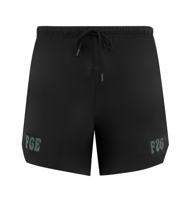 Image 1 of 3 - BLACK - Fear of God Essentials Mens Gym Shorts are crafted from polyester. Feature a relaxed mid-length fit, perforated stretch lining, elasticized waistband with bungee drawcord and toggle, side pockets, puff-printed FGE and F26 graphics, and an Essentials logo label. Main Material: 100% Polyester.