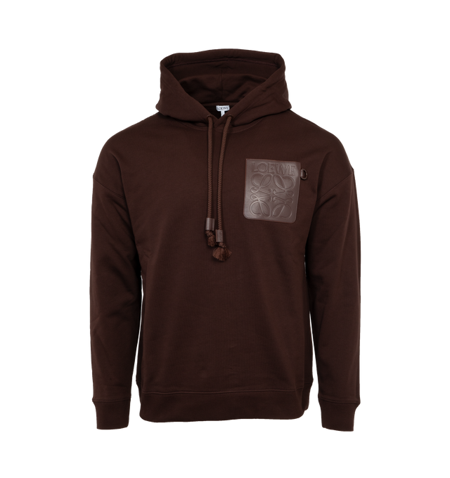 Image 1 of 3 - BROWN - LOEWE Relaxed Fit Hoodie featuring relaxed fit, regular length, LOEWE Anagram embossed leather patch pocket at the chest, hooded collar, drawstring with LOEWE embossed tab and ribbed cuffs and hem. 100% cotton.  