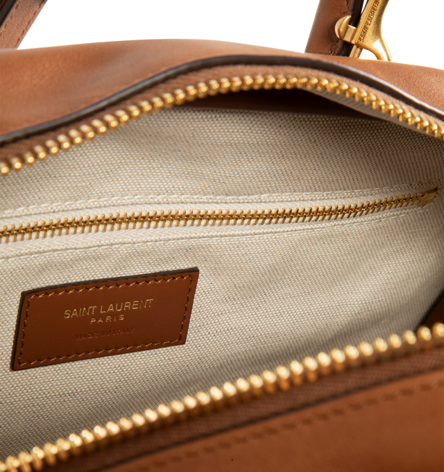 Image 3 of 3 - BROWN - SAINT LAURENT Sac de Jour Boston Bag featuring top handles, an adjustable and detachable strap, cotton and linen lining, bronze-tone hardware, zip closure and two zip pockets. Calfskin leather. Made in Italy.