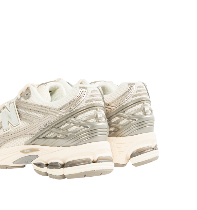 Image 3 of 5 - NEUTRAL - NEW BALANCE 1906R Sneaker featuring ACTEVA LITE midsole cushioning, ABZORB SBS heel cushioning, N-ergy outsole provides superior shock absorption, Stability Web outsole technology provides added arch support, TPU heel cage and rubber outsole. Mesh upper with synthetic overlays. Unisex style in men's sizes.