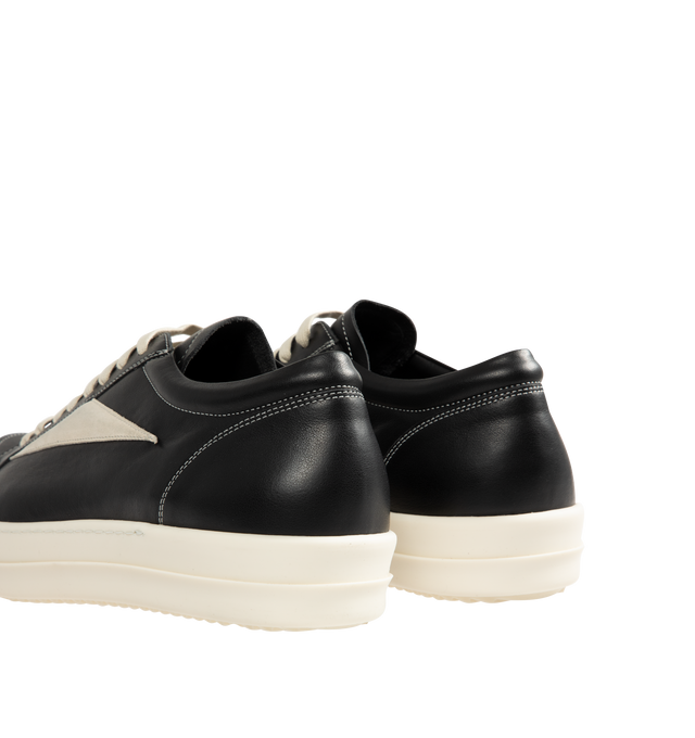 Image 3 of 5 - BLACK - Rick Owens Mens Vintage Sneakers feature a full-grain calf leather and suede upper. Designed with an under-ankle silhouette, eight-eyelet lace-up closure, toe cap, resized triangular leather side appliqu, padded ankle, contrast stitching, and shark-tooth thermoplastic rubber outsole. Upper: 100% Cow Leather; Lateral Details: 100% Calf Leather; Lining: 100% Calf Leather; Insole: 100% Calf Leather; Outsole: 100% Thermoplastic Rubber. Sole Height: 3.5 cm. Made in Italy.