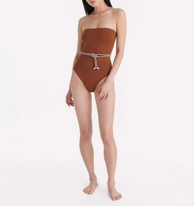 Image 2 of 5 - BROWN - ERES Majorette One-Piece Bustier Swimsuit featuring two-tone twisted belt to tie at the waist, gripper tape and side shirring. 84% Polyamid, 16% Spandex. Made in Morocco. 