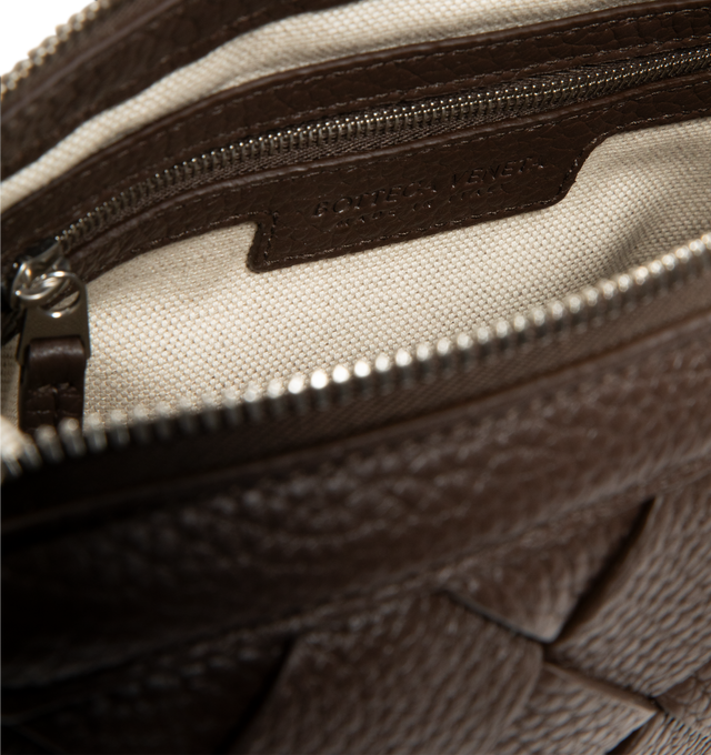 Image 3 of 3 - BROWN - BOTTEGA VENETA Diago Zipped Messenger Bag featuring zipped cross-body bag in grained Intreccio leather with adjustable strap, single interior zipped pocket and two flat open pockets. Calfskin. Lining: canvas. 5.9" x 9.8" x 2". Strap drop: 19.7". Made in Italy.