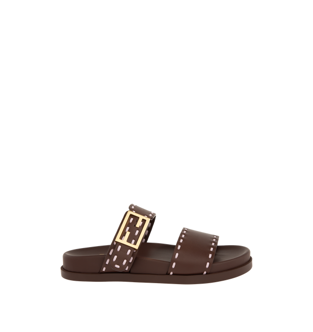 Image 1 of 4 - BROWN - FENDI Feel Slide Sandal featuring double-band flat slides with FF Baguette decorative buckle, hand-sewn contrasting macro Selleria topstitches and gold-finish metalware. 100% calfskin. Made in Italy.