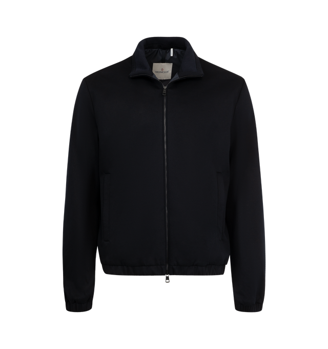 Image 1 of 3 - NAVY - MONCLER Simorre Jacket featuring cotton jersey technique, Airsoft lining, stand collar, zipper closure, zipped pockets, inner patch pocket with snap button closure, elastic cuffs, inner fabric description label and logo patch. 90% cotton, 10% polyamide/nylon. Lining: 100% polyester. Made in Romania.