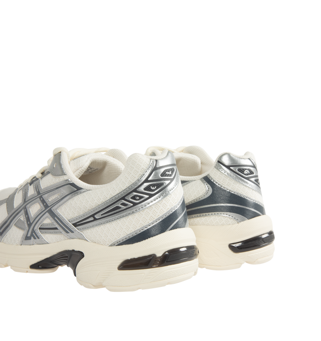 Image 3 of 5 - GREY - ASICS Mens GEL-1130 Sneakers feature a breathable mesh upper with metallic synthetic leather overlays. Designed with a lace-up closure, padded tongue and collar, GEL heel cushioning for shock absorption, cushioned footbed, breathable mesh lining, and a durable rubber outsole for flexible traction. Upper: Mesh and Synthetic Leather; Midsole: GEL Technology; Outsole: Rubber. Imported from Indonesia.