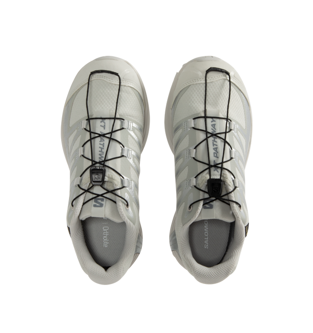 Image 5 of 5 - WHITE - Salomon XT-Pathway GTX Sneakers are a lace-up style with a quickLACE system, ACS stability, Mud Contagrip chevron rubber lug outsoles, anti-debris interior mesh, synthetic uppers, textile linings, lace pockets, protective toe caps, protective mudguards, OrthoLite die-cut sock liners, and GORE-TEX waterproofing. Unisex style in men's sizing.
