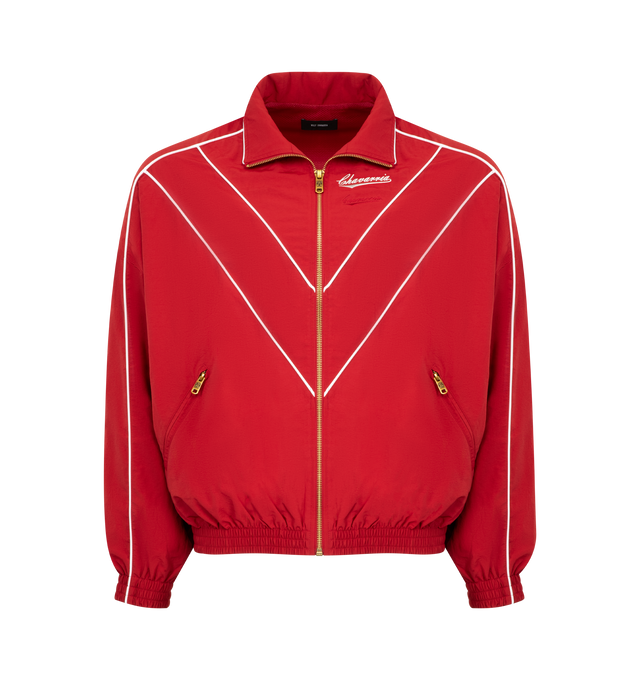 Image 1 of 2 - RED - WILLY CHAVARRIA Bad Boy Track Jacket featuring front zipper closure, side slant pockets with zipper closer, logo detail on left side of chest and elastic at waist. 100% nylon. Made in USA.