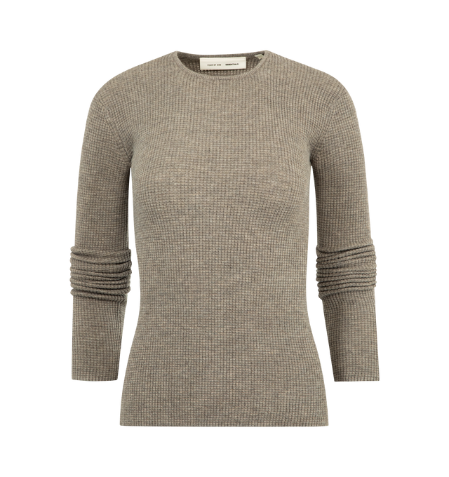 Image 1 of 2 - BROWN - FEAR OF GOD ESSENTIALS Waffle Long Sleeve Top featuring a poly-nylon waffle knit, form-fitting silhouette, rib-knit crewneck and a Fear of God Essentials label positioned at the back. 88% polyester, 12% nylon waffle knit.
